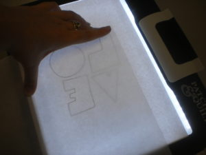 Photo 5: Place the LOVE template on your lightbox or window.